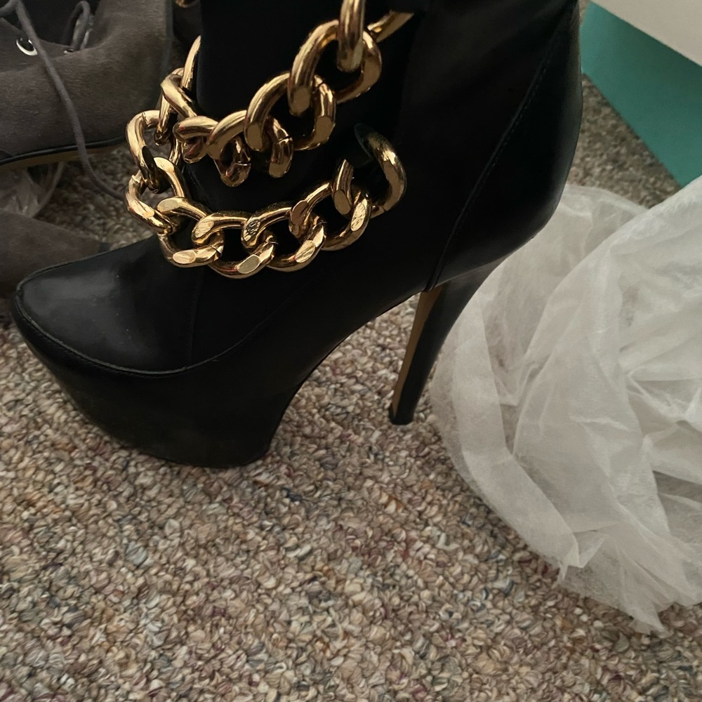 Black leather high heel and platform booties with zipper